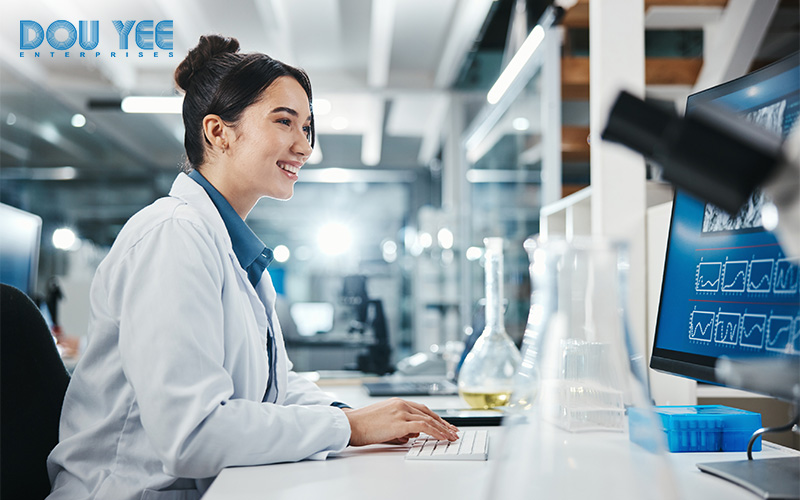 Scientist using an eQMS to manage lab processes.